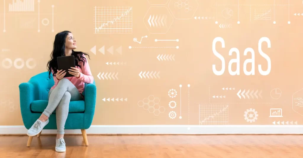 Girl sitting on a armchair and looking at SaaS title